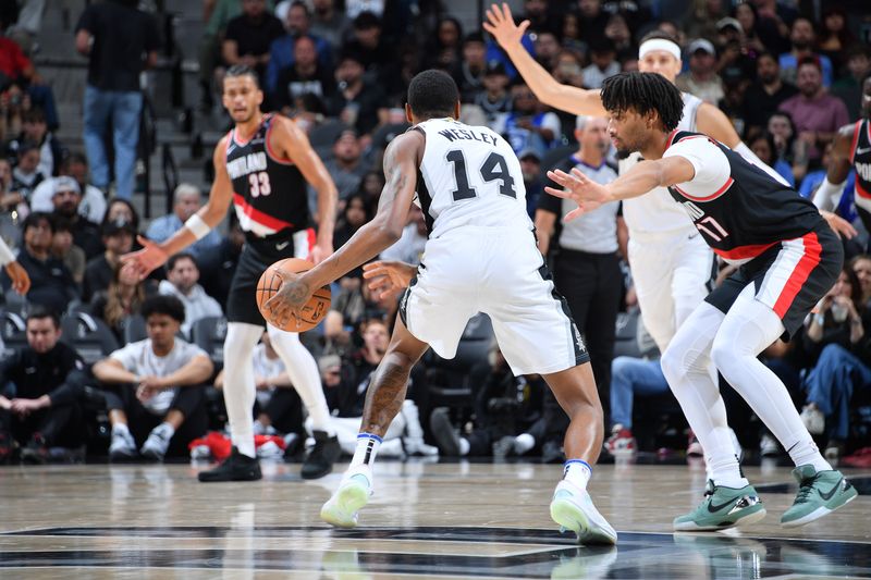 SAN ANTONIO, TX - NOVEMBER 7: Blake Wesley #14 of the San Antonio Spurs dribbles the ball during the game against the Portland Trail Blazers on November 7, 2024 at the Frost Bank Center in San Antonio, Texas. NOTE TO USER: User expressly acknowledges and agrees that, by downloading and or using this photograph, user is consenting to the terms and conditions of the Getty Images License Agreement. Mandatory Copyright Notice: Copyright 2024 NBAE (Photos by Michael Gonzales/NBAE via Getty Images)