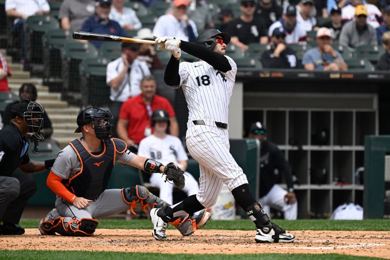Jun 5, 2025; Chicago, Illinois, USA;  Chicago White Sox outfielder Mike Tauchman (18)  hits a sacrifice fly RBI against the Detroit Tigers during the fourth inning at Rate Field. Mandatory Credit: Matt Marton-Imagn Images