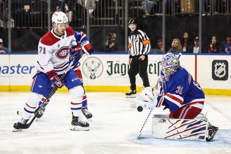 Apr 7, 2024; New York, New York, USA;  New York Rangers goaltender Igor Shesterkin (31) makes a save on a shot on goal attempt by Montreal Canadiens center Jake Evans (71) in the third period at Madison Square Garden. Mandatory Credit: Wendell Cruz-USA TODAY Sports