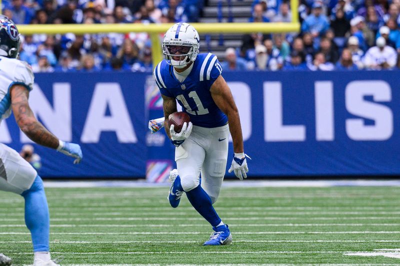 Indianapolis Colts wide receiver Michael Pittman Jr. (11) runs down the field after a catch during an NFL football game against the Tennessee Titans, Sunday, Oct. 8, 2023, in Indianapolis. (AP Photo/Zach Bolinger)