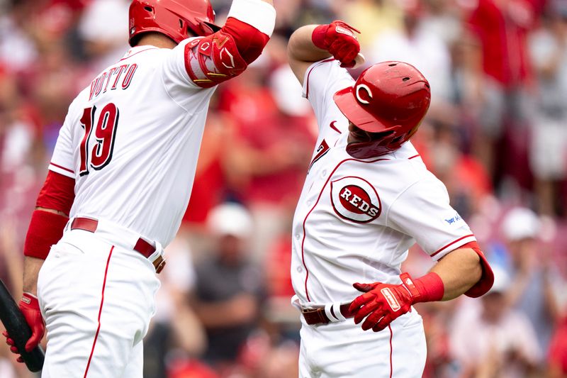 Aug 9, 2023; Cincinnati, OH, USA; Cincinnati Reds left fielder Spencer Steer (7) celebrates with Cincinnati Reds first baseman Joey Votto (19) after hitting a game tying solo home run in the fourth inning of the MLB baseball game between Cincinnati Reds and Miami Marlins at Great American Ball Park in Cincinnati on Wednesday, Aug. 9, 2023.  Mandatory Credit: Albert Cesare-USA TODAY Sports