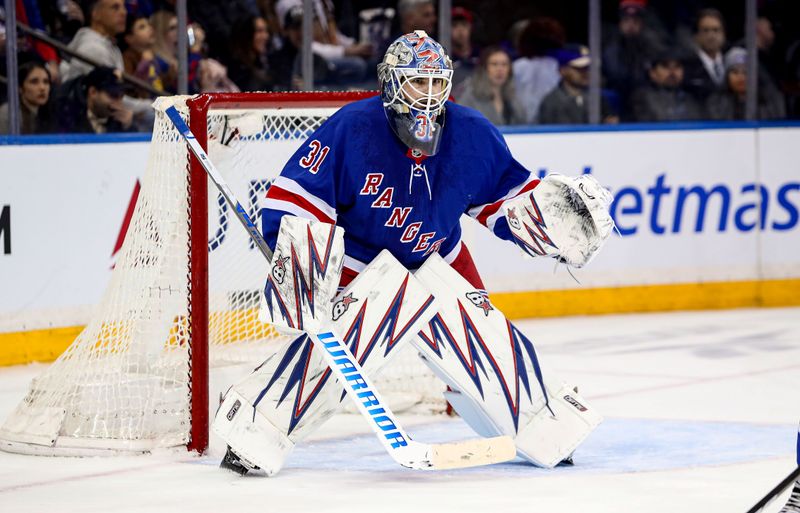 Jan 18, 2025; New York, New York, USA; New York Rangers goalie Igor Shesterkin (31) guards the net against the Columbus Blue Jackets during the second period at Madison Square Garden. Mandatory Credit: Danny Wild-Imagn Images