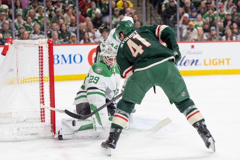 Apr 6, 2025; Saint Paul, Minnesota, USA; Minnesota Wild center Gustav Nyquist (41) shoots on Dallas Stars goaltender Jake Oettinger (29) in the second period at Xcel Energy Center. Mandatory Credit: Matt Blewett-Imagn Images