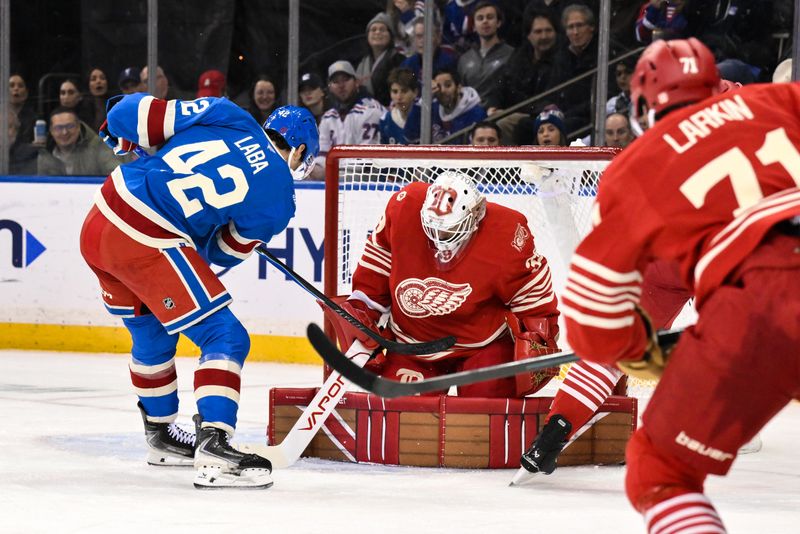 Nov 16, 2025; New York, New York, USA; Detroit Red Wings goaltender Cam Talbot (39) makes a save against New York Rangers center Noah Laba (42) during the first period at Madison Square Garden. Mandatory Credit: John Jones-Imagn Images