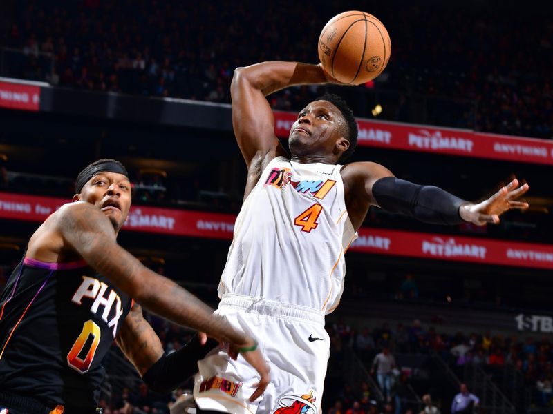 PHOENIX, AZ - JANUARY 6: Victor Oladipo #4 of the Miami Heat drives to the basket during the game against the Phoenix Suns on January 6, 2023 at Footprint Center in Phoenix, Arizona. NOTE TO USER: User expressly acknowledges and agrees that, by downloading and or using this photograph, user is consenting to the terms and conditions of the Getty Images License Agreement. Mandatory Copyright Notice: Copyright 2022 NBAE (Photo by Barry Gossage/NBAE via Getty Images)