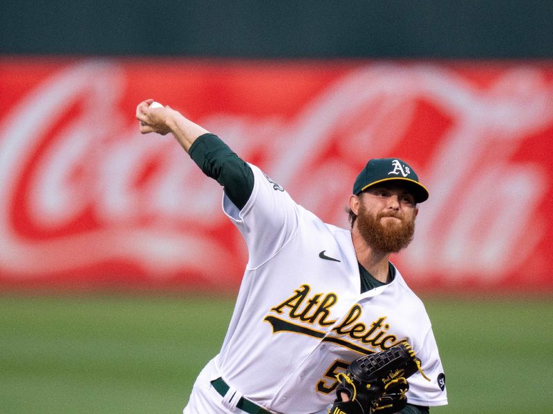 Sep 19, 2023; Oakland, California, USA; Oakland Athletics starting pitcher Paul Blackburn (58) delivers a pitch against the Seattle Mariners during the first inning at Oakland-Alameda County Coliseum. Mandatory Credit: Neville E. Guard-USA TODAY Sports