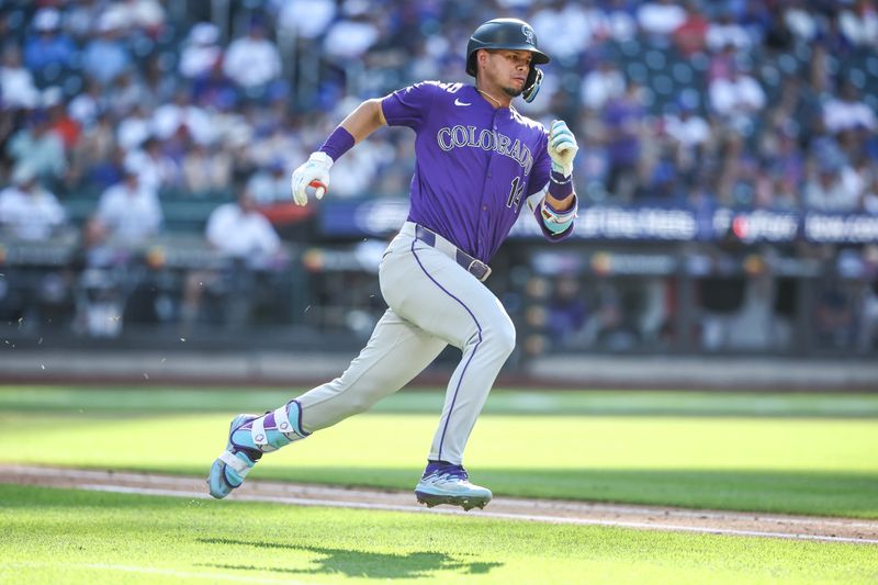 Jul 13, 2024; New York City, New York, USA;  Colorado Rockies shortstop Ezequiel Tovar (14) hits as double in the fifth inning against the New York Mets at Citi Field. Mandatory Credit: Wendell Cruz-USA TODAY Sports