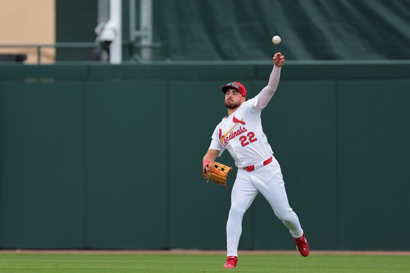 Feb 24, 2025; Jupiter, Florida, USA; St. Louis Cardinals outfielder Michael Siani (22) throws the baseball against the New York Mets during the third inning at Roger Dean Chevrolet Stadium. Mandatory Credit: Sam Navarro-Imagn Images