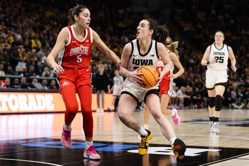 Mar 5, 2023; Minneapolis, MINN, USA; Iowa Hawkeyes guard Caitlin Clark (22) drives to the basket while Ohio State Buckeyes guard Emma Shumate (5) defends during the first half at Target Center. Mandatory Credit: Matt Krohn-USA TODAY Sports