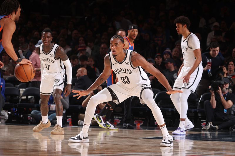 NEW YORK, NY - MARCH 23: Nicolas Claxton #33 of the Brooklyn Nets plays defense during the game against the New York Knicks on March 23, 2024 at Madison Square Garden in New York City, New York.  NOTE TO USER: User expressly acknowledges and agrees that, by downloading and or using this photograph, User is consenting to the terms and conditions of the Getty Images License Agreement. Mandatory Copyright Notice: Copyright 2024 NBAE  (Photo by Nathaniel S. Butler/NBAE via Getty Images)