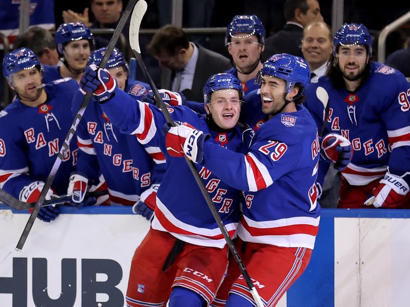 Mar 27, 2026; New York, New York, USA; New York Rangers left wing Adam Sykora (38) celebrates his goal against the Chicago Blackhawks with defenseman Matthew Robertson (29) during the second period at Madison Square Garden. The goal was the first of his NHL career. Mandatory Credit: Brad Penner-Imagn Images
