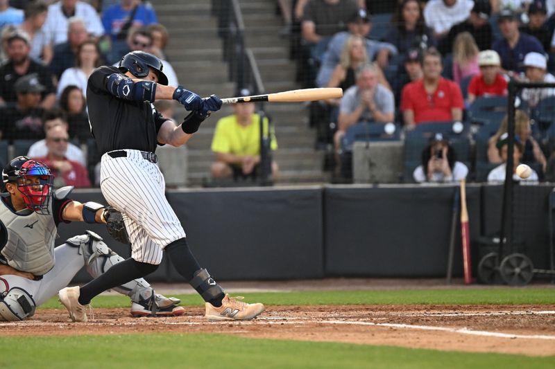 Mar 19, 2025; Tampa, Florida, USA; New York Yankees catcher Austin Wells (28) hits a single in the fourth  inning against the Atlanta Braves during spring training at George M. Steinbrenner Field. Mandatory Credit: Jonathan Dyer-Imagn Images