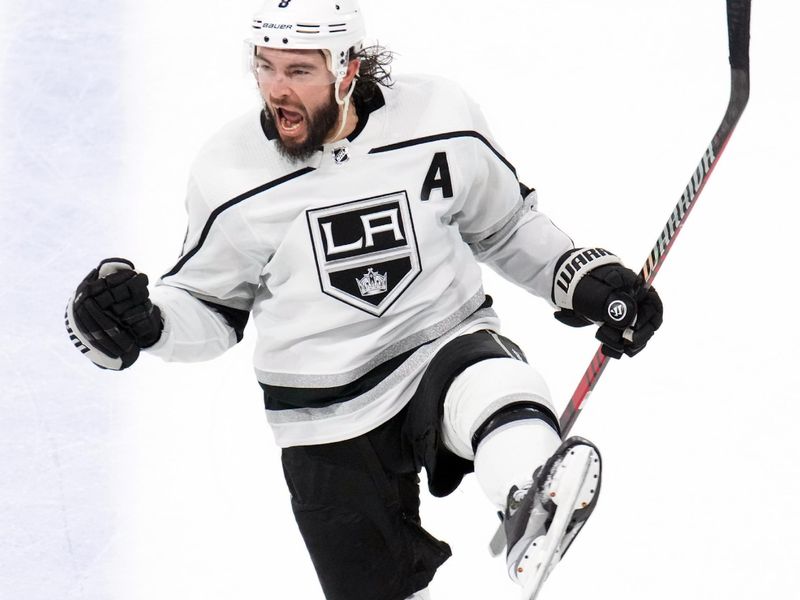 Oct 27, 2023; Tempe, Arizona, USA; Los Angeles Kings defenseman Drew Doughty (8) celebrates a goal against the Arizona Coyotes during the third period at Mullett Arena. Mandatory Credit: Joe Camporeale-USA TODAY Sports