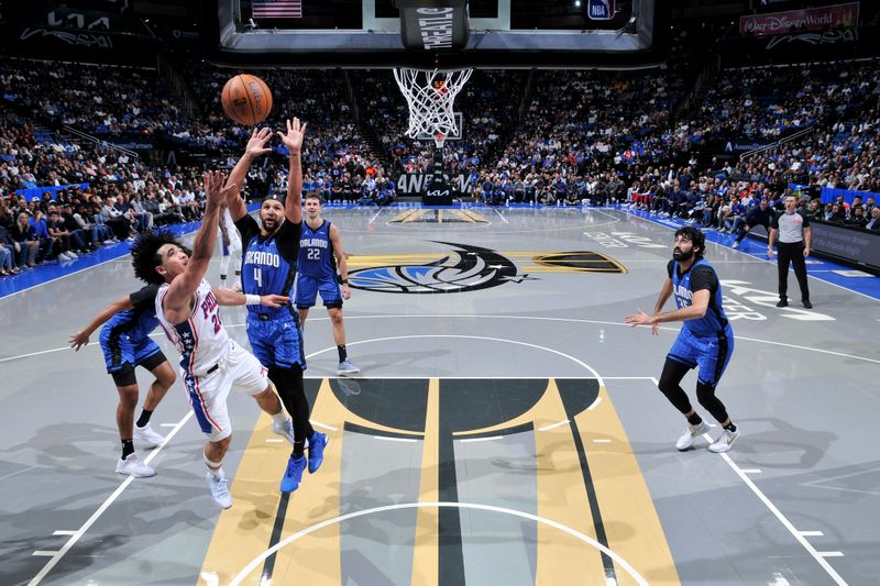 ORLANDO, FL - NOVEMBER 15: Jared McCain #20 of the Philadelphia 76ers shoots the ball during the game against the Orlando Magic during the Emirates NBA Cup game on  November 15, 2024 at Kia Center in Orlando, Florida. NOTE TO USER: User expressly acknowledges and agrees that, by downloading and or using this photograph, User is consenting to the terms and conditions of the Getty Images License Agreement. Mandatory Copyright Notice: Copyright 2024 NBAE (Photo by Fernando Medina/NBAE via Getty Images)