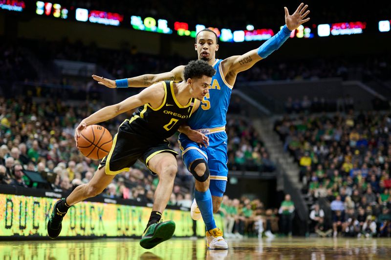 Feb 11, 2023; Eugene, Oregon, USA; Oregon Ducks guard Will Richardson (0) drives to the basket during the first half against UCLA Bruins guard Amari Bailey (5) at Matthew Knight Arena. Mandatory Credit: Troy Wayrynen-USA TODAY Sports