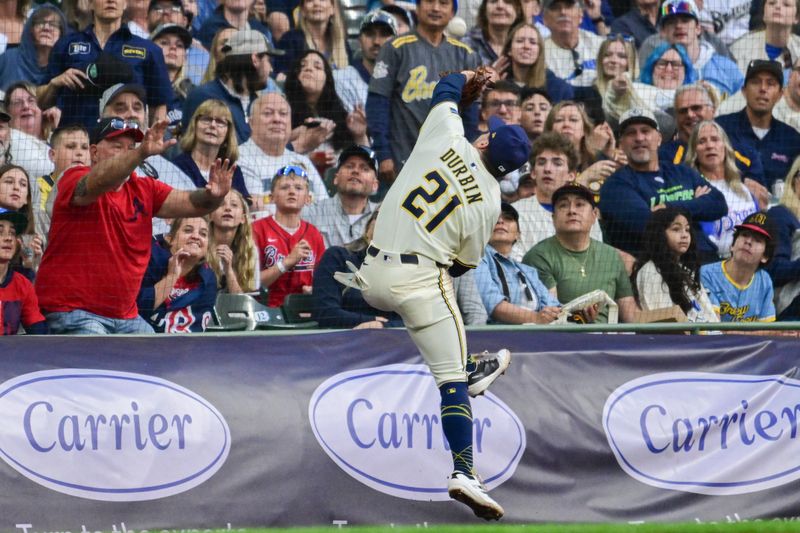 Jun 10, 2025; Milwaukee, Wisconsin, USA; Milwaukee Brewers third baseman Caleb Durbin (21) catches foul ball hit by Atlanta Braves first baseman Matt Olson (not pictured) in the fifth inning at American Family Field. Mandatory Credit: Benny Sieu-Imagn Images