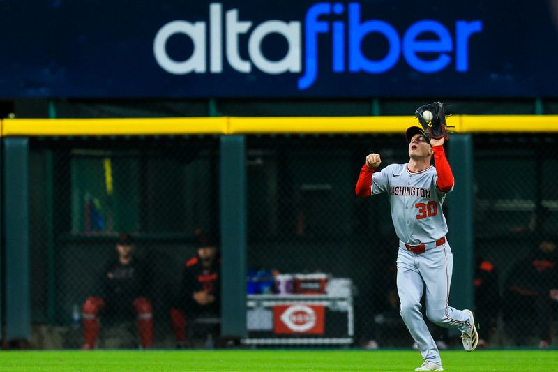 May 2, 2025; Cincinnati, Ohio, USA; Washington Nationals outfielder Jacob Young (30) catches a fly out hit by Cincinnati Reds third baseman Noelvi Marte (not pictured) in the first inning at Great American Ball Park. Mandatory Credit: Katie Stratman-Imagn Images
