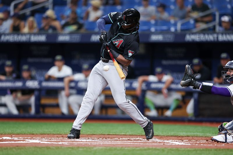 Aug 16, 2024; St. Petersburg, Florida, USA; Arizona Diamondbacks first baseman Josh Bell (36) hits an rbi single against the Tampa Bay Rays in the first inning at Tropicana Field. Mandatory Credit: Nathan Ray Seebeck-USA TODAY Sports