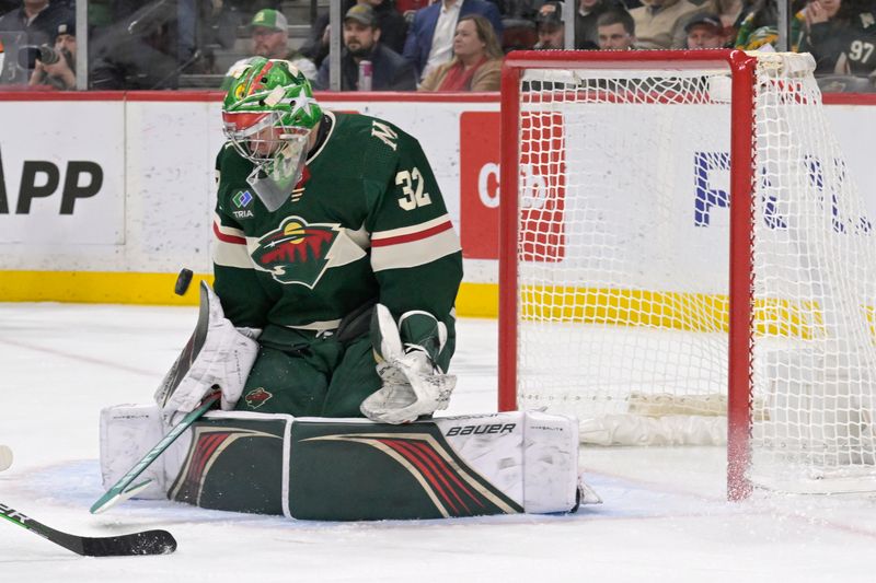 Jan 23, 2024; Saint Paul, Minnesota, USA;  Minnesota Wild goalie Filip Gustavsson (32) makes a save against the Washington Capitals during the third period at Xcel Energy Center. Mandatory Credit: Nick Wosika-USA TODAY Sports