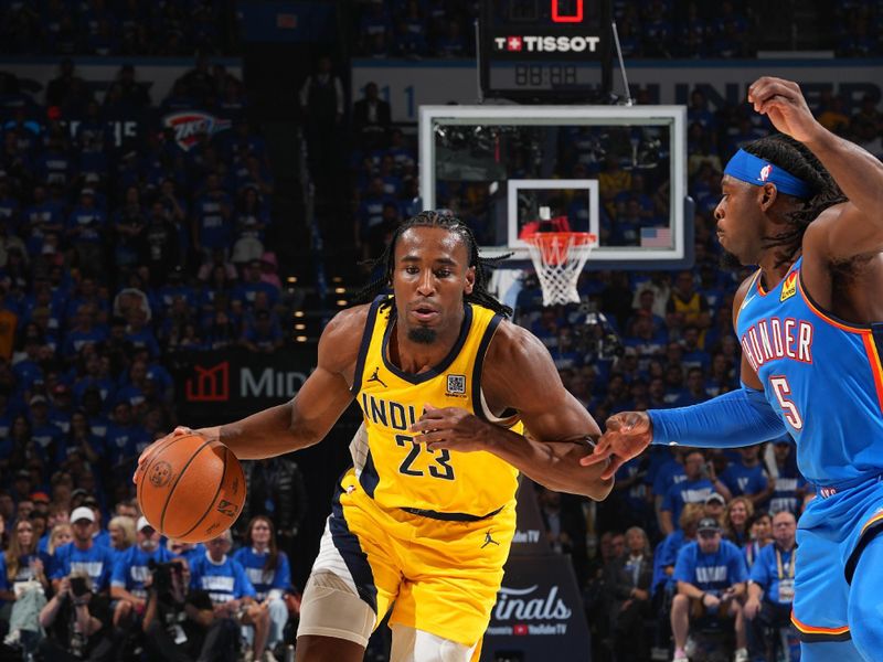 OKLAHOMA CITY, OK - JUNE 8:  Aaron Nesmith #23 of the Indiana Pacers dribbles the ball during the game against the Oklahoma City Thunder during Game Two of the 2025 NBA Finals on June 8, 2025 at Paycom Center in Oklahoma City, Oklahoma. NOTE TO USER: User expressly acknowledges and agrees that, by downloading and or using this photograph, User is consenting to the terms and conditions of the Getty Images License Agreement. Mandatory Copyright Notice: Copyright 2025 NBAE (Photo by Jesse D. Garrabrant/NBAE via Getty Images)