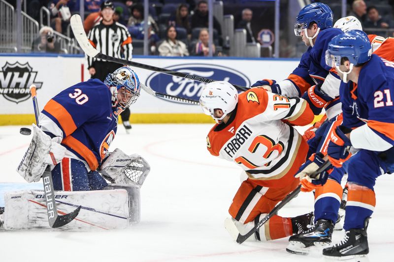 Oct 29, 2024; Elmont, New York, USA; New York Islanders goaltender Ilya Sorokin (30) makes a save on a shot on goal attempt by Anaheim Ducks center Robby Fabbri (13) in the first period at UBS Arena. Mandatory Credit: Wendell Cruz-Imagn Images