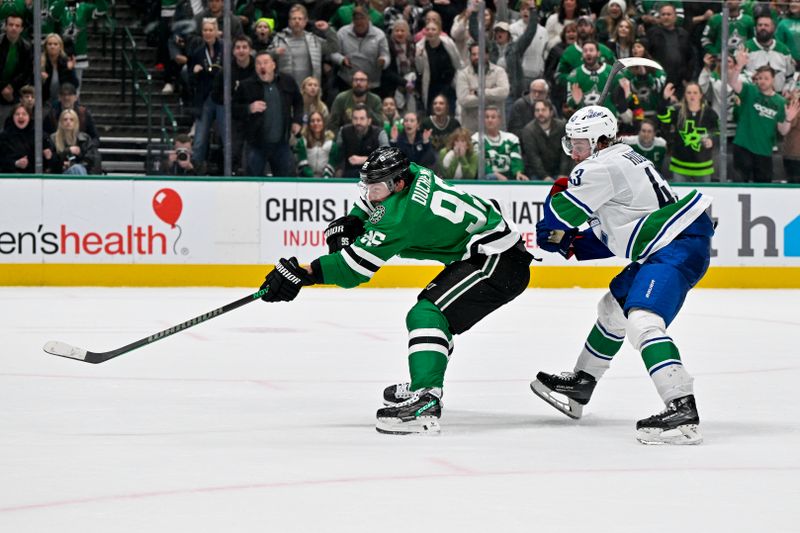 Dec 21, 2023; Dallas, Texas, USA; Dallas Stars center Matt Duchene (95) scores the game winning goal past Vancouver Canucks defenseman Quinn Hughes (43) during the overtime period at the American Airlines Center. Mandatory Credit: Jerome Miron-USA TODAY Sports