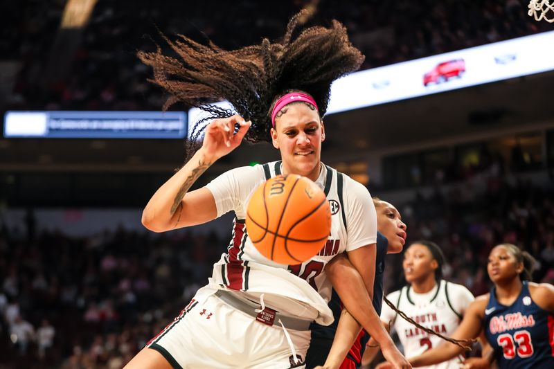 Feb 4, 2024; Columbia, South Carolina, USA; South Carolina Gamecocks center Kamilla Cardoso (10) gets tangled with Ole Miss Rebels forward Madison Scott (24) in the second half at Colonial Life Arena. Mandatory Credit: Jeff Blake-USA TODAY Sports