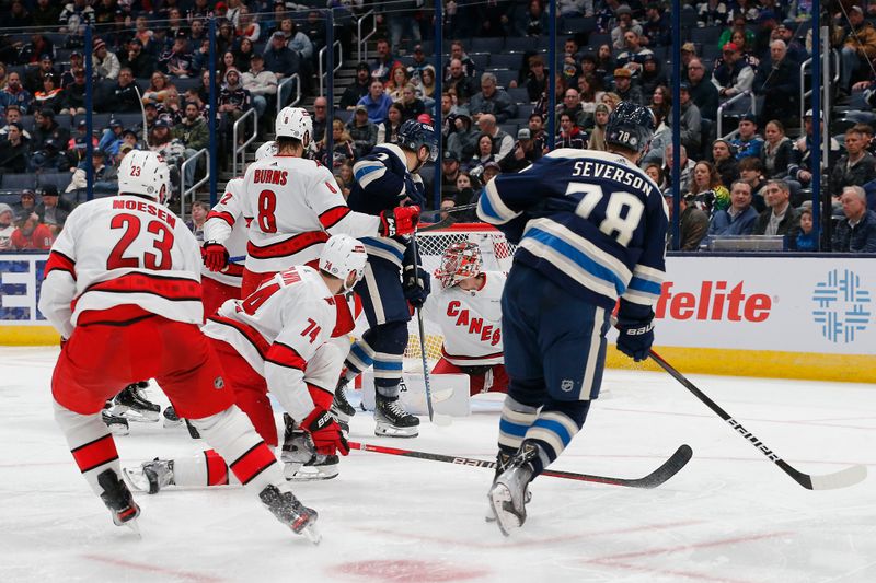 Feb 29, 2024; Columbus, Ohio, USA; Carolina Hurricanes goalie Spencer Martin (41) makes a save on the shot of Columbus Blue Jackets defenseman Damon Severson (78) during the third period at Nationwide Arena. Mandatory Credit: Russell LaBounty-USA TODAY Sports