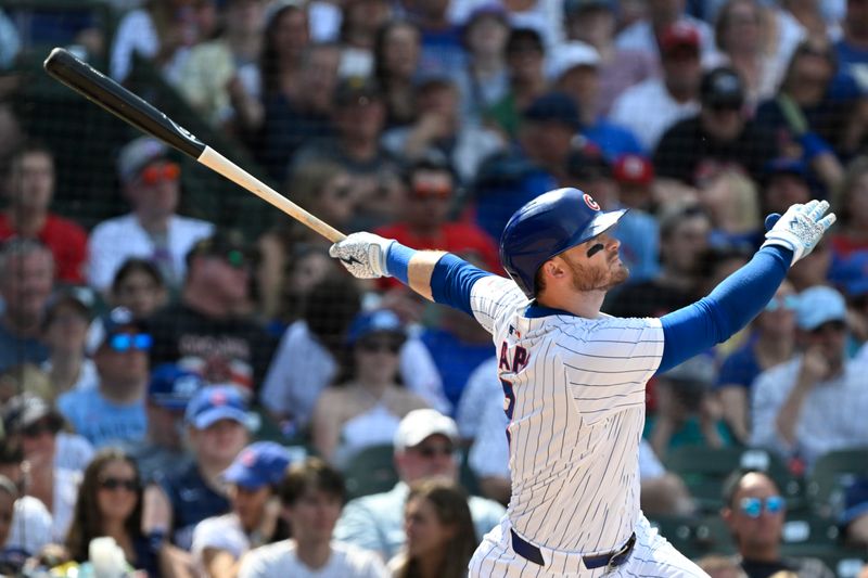 Jun 15, 2024; Chicago, Illinois, USA;  Chicago Cubs outfielder Ian Happ (8) hits a three run home run against the St. Louis Cardinals during the seventh inning at Wrigley Field. Mandatory Credit: Matt Marton-USA TODAY Sports