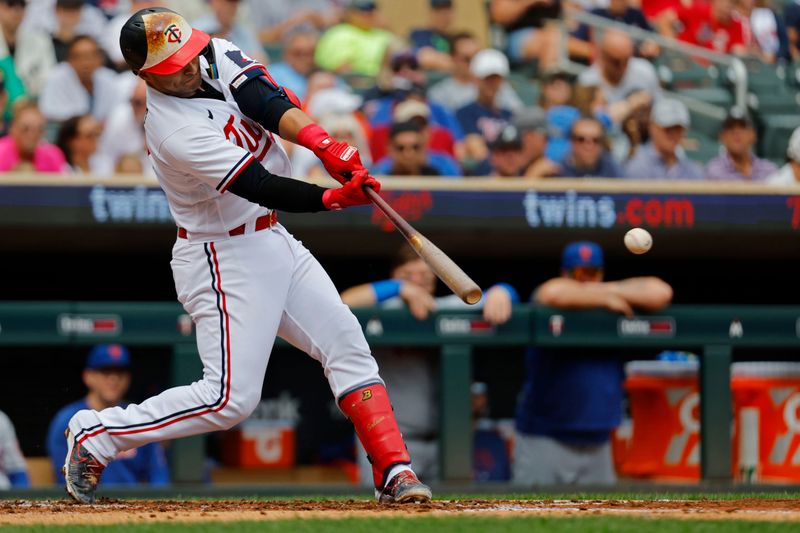 Sep 9, 2023; Minneapolis, Minnesota, USA; Minnesota Twins first baseman Donovan Solano (39) hits a two-run single against the New York Mets in the second inning at Target Field. Mandatory Credit: Bruce Kluckhohn-USA TODAY Sports