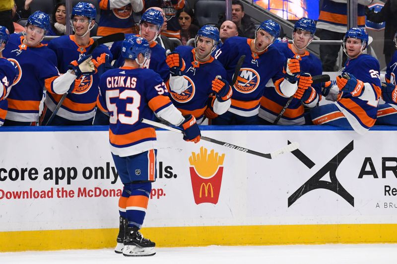 Dec 13, 2023; Elmont, New York, USA; New York Islanders center Casey Cizikas (53) celebrates his goal with the New York Islanders bench against the Anaheim Ducks during the second period at UBS Arena. Mandatory Credit: Dennis Schneidler-USA TODAY Sports