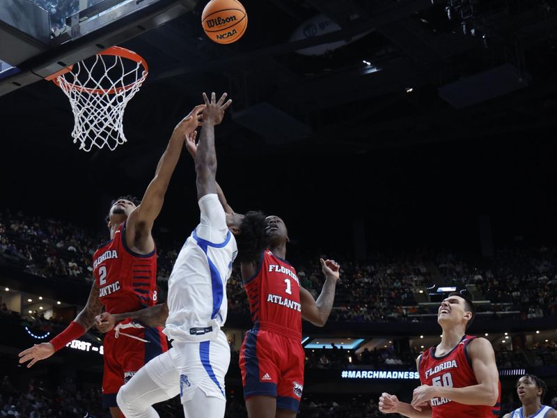 Mar 17, 2023; Columbus, OH, USA; Memphis Tigers guard Kendric Davis (3) shoots the ball over Florida Atlantic Owls guard Nicholas Boyd (2) in the first half at Nationwide Arena. Mandatory Credit: Rick Osentoski-USA TODAY Sports