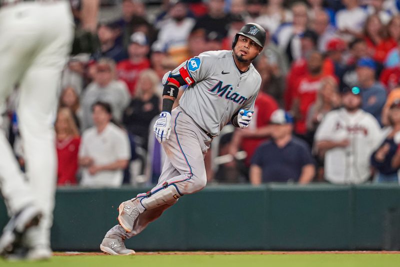 Apr 23, 2024; Cumberland, Georgia, USA; Miami Marlins second base Luis Arraez (3) on base after a single against the Atlanta Braves during the ninth inning at Truist Park. Mandatory Credit: Dale Zanine-USA TODAY Sports