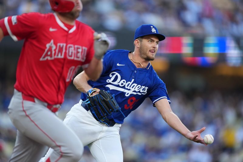 Mar 23, 2025; Los Angeles, California, USA; Los Angeles Dodgers pitcher Jackson Ferris (93) throws the ball to first base to retire Los Angeles Angels first base Nolan Schanuel (18) in the foruth inning at Dodger Stadium. Mandatory Credit: Kirby Lee-Imagn Images