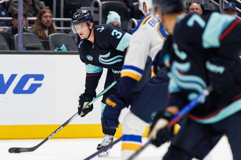 Oct 8, 2024; Seattle, Washington, USA;Seattle Kraken defenseman Will Borgen (3) moves the puck against the St. Louis Blues during the first period at Climate Pledge Arena. Mandatory Credit: Caean Couto-Imagn Images