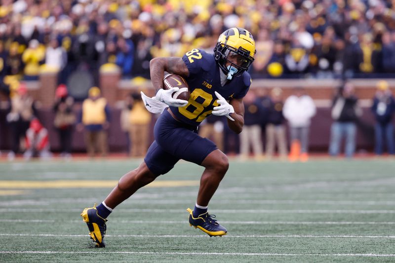 Nov 25, 2023; Ann Arbor, Michigan, USA; Michigan Wolverines wide receiver Semaj Morgan (82) runs the ball in the second half against the Ohio State Buckeyes at Michigan Stadium. Mandatory Credit: Rick Osentoski-USA TODAY Sports