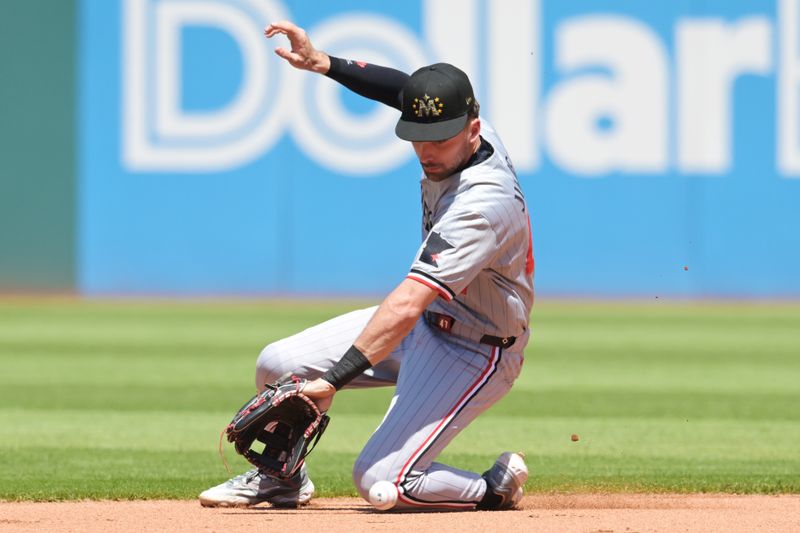 May 19, 2024; Cleveland, Ohio, USA; Minnesota Twins second baseman Edouard Julien (47) fields a ball hit by Cleveland Guardians first baseman Josh Naylor (not pictured) during the fourth inning at Progressive Field. Mandatory Credit: Ken Blaze-USA TODAY Sports