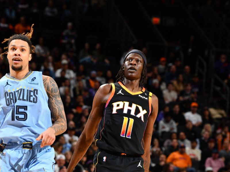 PHOENIX, AZ - FEBRUARY 11:  Bol Bol #11 of the Phoenix Suns looks on during the game against the Memphis Grizzlies on February 11, 2025 at Footprint Center in Phoenix, Arizona. NOTE TO USER: User expressly acknowledges and agrees that, by downloading and or using this photograph, user is consenting to the terms and conditions of the Getty Images License Agreement. Mandatory Copyright Notice: Copyright 2025 NBAE (Photo by Barry Gossage/NBAE via Getty Images)