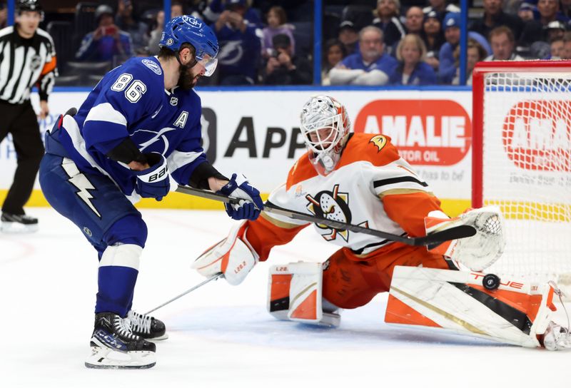 Jan 16, 2025; Tampa, Florida, USA; Tampa Bay Lightning right wing Nikita Kucherov (86) shoots as Anaheim Ducks goaltender Lukas Dostal (1) makes a save during overtime shootout at Amalie Arena. Mandatory Credit: Kim Klement Neitzel-Imagn Images