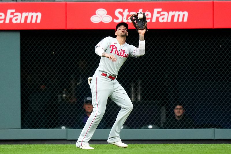 May 12, 2023; Denver, Colorado, USA; Philadelphia Phillies right fielder Nick Castellanos (8) fields the ball in the first inning against the Colorado Rockies at Coors Field. Mandatory Credit: Ron Chenoy-USA TODAY Sports