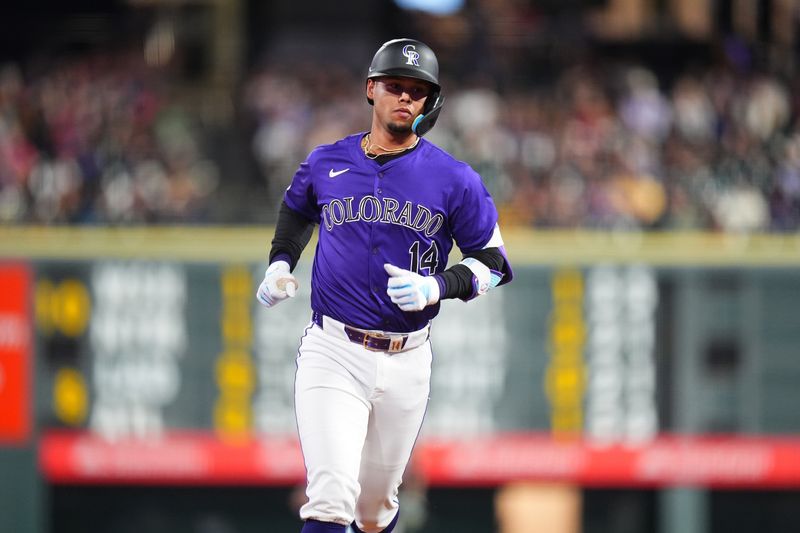 Sep 16, 2024; Denver, Colorado, USA; Colorado Rockies shortstop Ezequiel Tovar (14) runs off a solo home run in the fourth inning against the Arizona Diamondbacks at Coors Field. Mandatory Credit: Ron Chenoy-Imagn Images