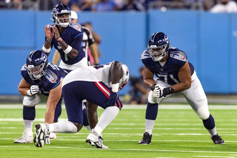 Tennessee Titans offensive tackle Andre Dillard (71) prepares to block during their NFL football game against the New England Patriots Friday, Aug. 25, 2023, in Nashville, Tenn. (AP Photo/Wade Payne)