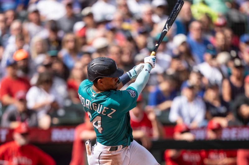 Sep 13, 2023; Seattle, Washington, USA; Seattle Mariners centerfielder Julio Rodriguez (44) hits an RBI-double during the third inning against the Los Angeles Angels at T-Mobile Park. Mandatory Credit: Stephen Brashear-USA TODAY Sports