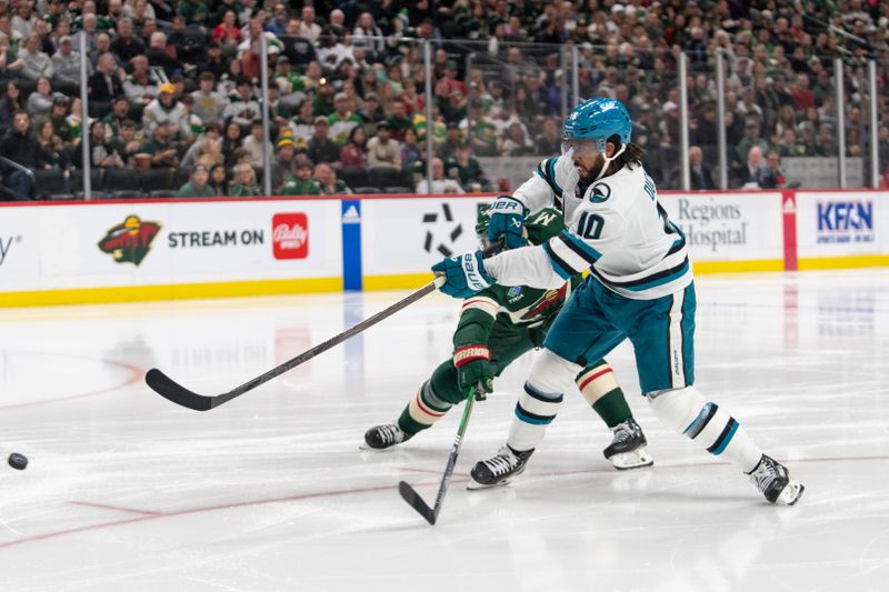 Mar 3, 2024; Saint Paul, Minnesota, USA; San Jose Sharks left wing Anthony Duclair (10) shoots and scores, Minnesota Wild defenseman Jake Middleton (5) on defense in the third period at Xcel Energy Center. Mandatory Credit: Matt Blewett-USA TODAY Sports