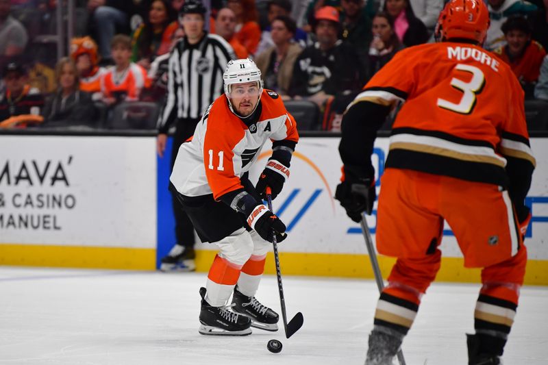 Mar 18, 2026; Anaheim, California, USA; Philadelphia Flyers right wing Travis Konecny (11) moves the puck against the Anaheim Ducks during the third period at Honda Center. Mandatory Credit: Gary A. Vasquez-Imagn Images