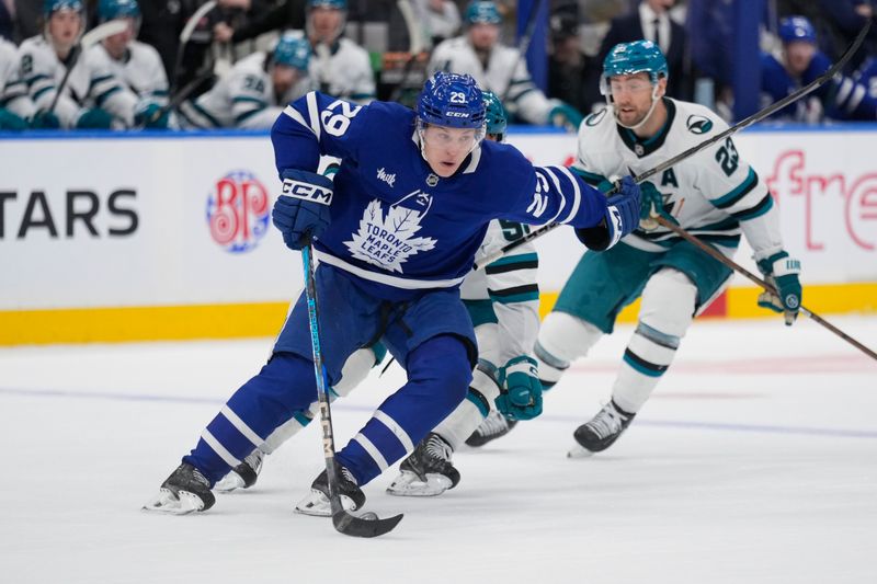 Mar 3, 2025; Toronto, Ontario, CAN; Toronto Maple Leafs forward Pontus Holmberg (29) carries the puck against the San Jose Sharks during the second period at Scotiabank Arena. Mandatory Credit: John E. Sokolowski-Imagn Images