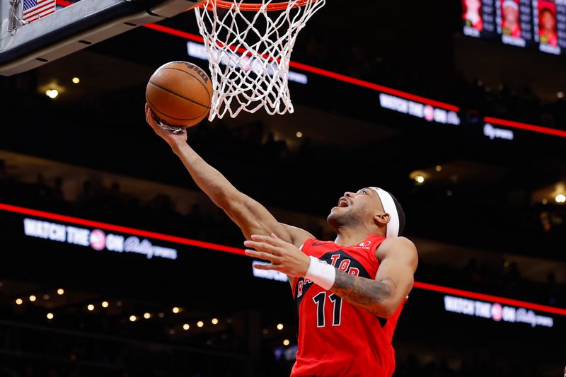 ATLANTA, GEORGIA - FEBRUARY 23: Bruce Brown #11 of the Toronto Raptors goes up for a shot during the fourth quarter against the Atlanta Hawks at State Farm Arena on February 23, 2024 in Atlanta, Georgia. NOTE TO USER: User expressly acknowledges and agrees that, by downloading and or using this photograph, User is consenting to the terms and conditions of the Getty Images License Agreement. (Photo by Todd Kirkland/Getty Images)