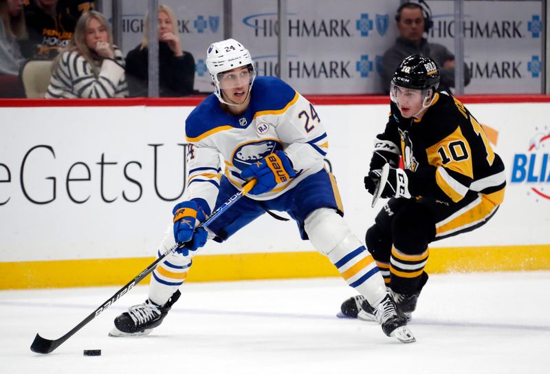 Jan 6, 2024; Pittsburgh, Pennsylvania, USA;  Buffalo Sabres center Dylan Cozens (24) skates with the puck ahead of Pittsburgh Penguins left wing Drew O'Connor (10) during the second period at PPG Paints Arena. Buffalo won 3-1. Mandatory Credit: Charles LeClaire-USA TODAY Sports