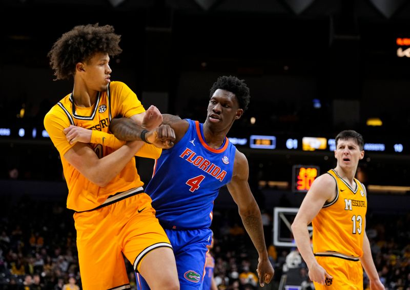 Jan 20, 2024; Columbia, Missouri, USA; Missouri Tigers forward Jordan Butler (0) and Florida Gators forward Tyrese Samuel (4) get tangled up during the second half at Mizzou Arena. Mandatory Credit: Jay Biggerstaff-USA TODAY Sports