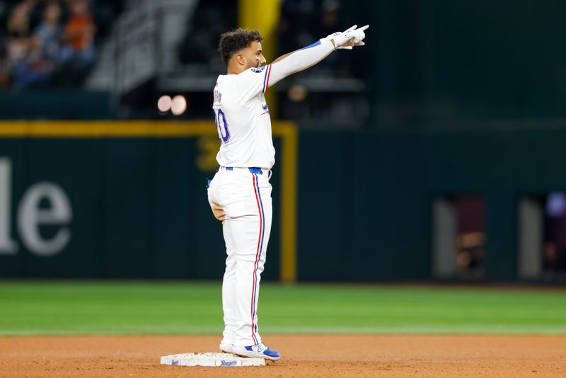 Sep 4, 2024; Arlington, Texas, USA; Texas Rangers second base Ezequiel Duran (20) celebrates a double during the seventh inning against the New York Yankees at Globe Life Field. Mandatory Credit: Andrew Dieb-Imagn Images